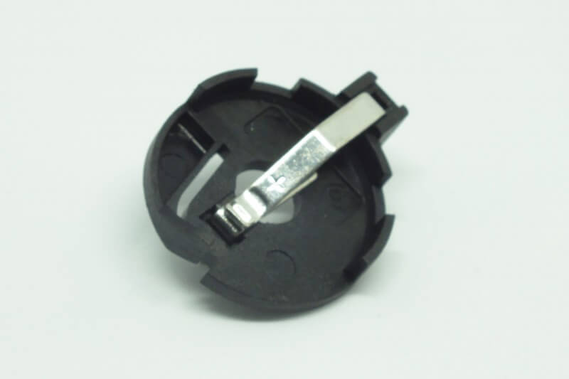 Portabatteria a bottone